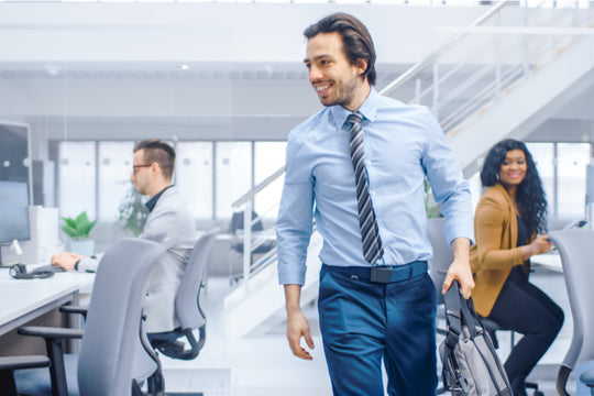 men with backpack entering his office