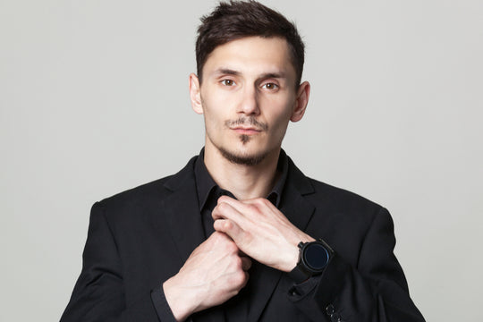 man pulling neck on black shirt