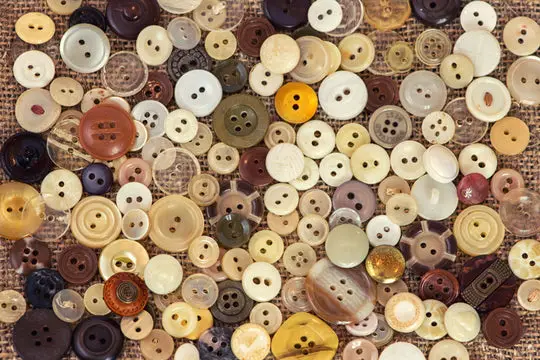 Pile of multi colored shirt buttons